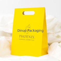 Bekleidung Verpackung Die Cut Handle Einkauf Kraftpapiertasche kundenspezifische gelbe Geschenktaschen
